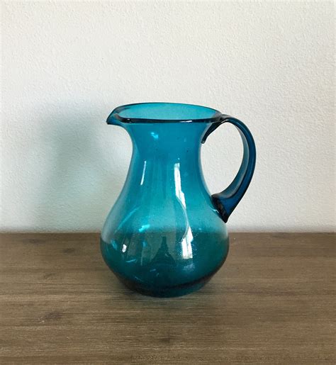 blue glass pitcher vintage|hand blown blue glass pitcher.